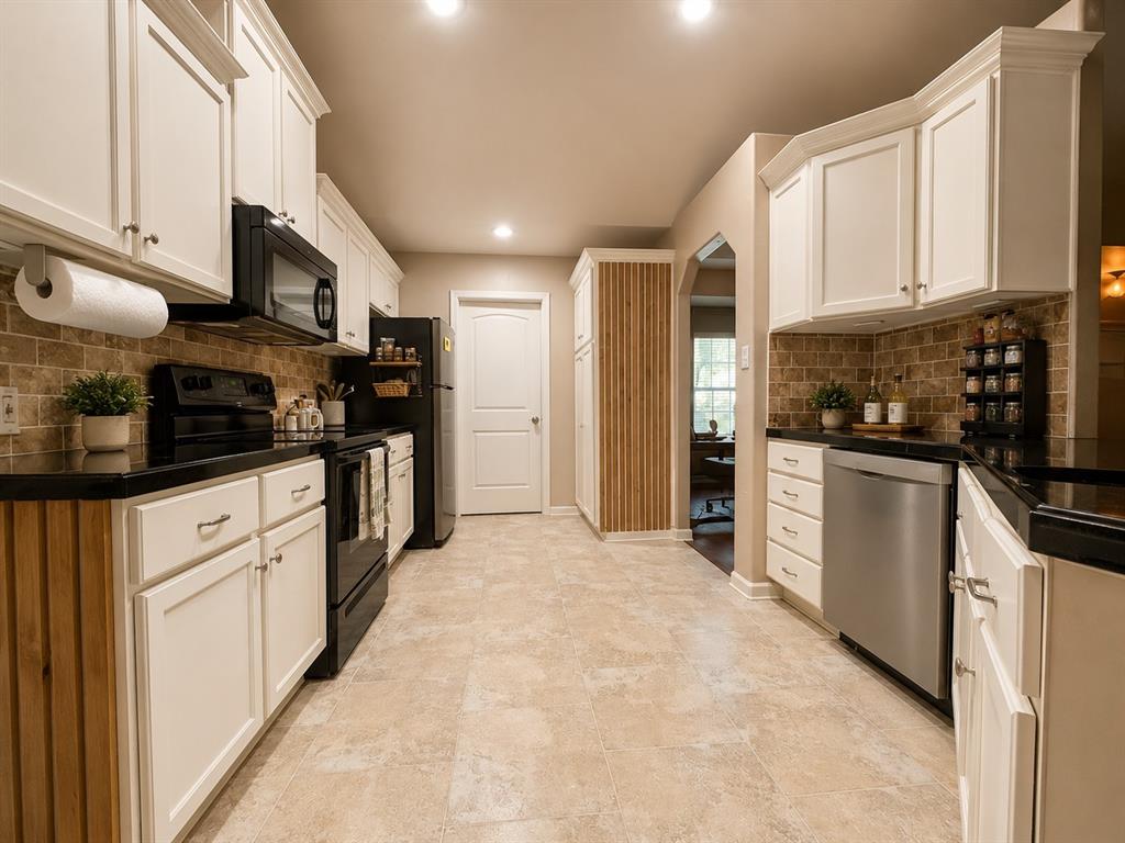 420 Sessums Road Springtown, TX 76082 - Photo 11 of 40 Kitchen featuring white cabinetry, black countertops, stainless steel appliances, a tiled backsplash, and recessed lighting-virtually staged