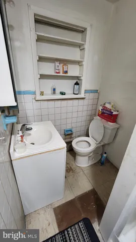 a bathroom with a sink toilet and a vanity