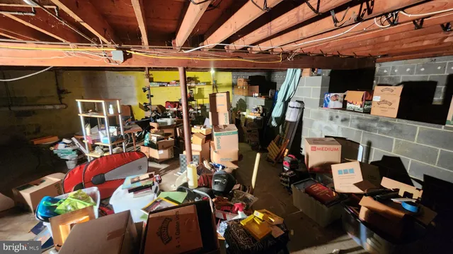 a room with lots of different furniture and a flat screen tv