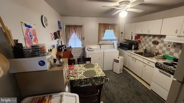 a kitchen with a refrigerator and a stove