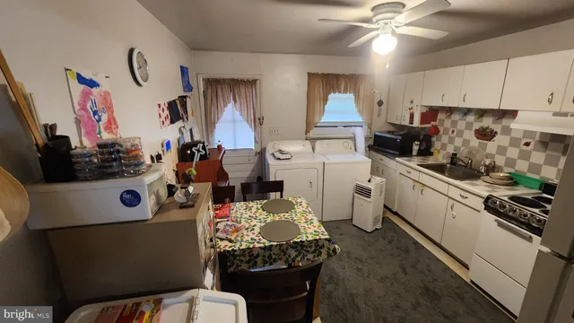 a kitchen with a refrigerator and a stove