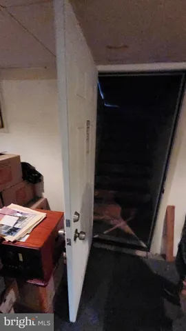 a bed sitting in a bedroom next to a small yard