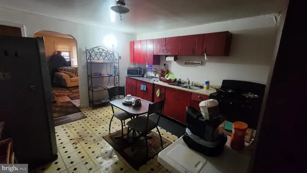 a kitchen with a sink and a refrigerator