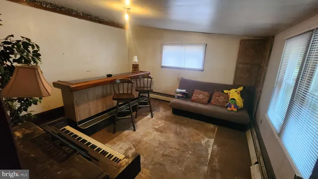 a living room with furniture and a window