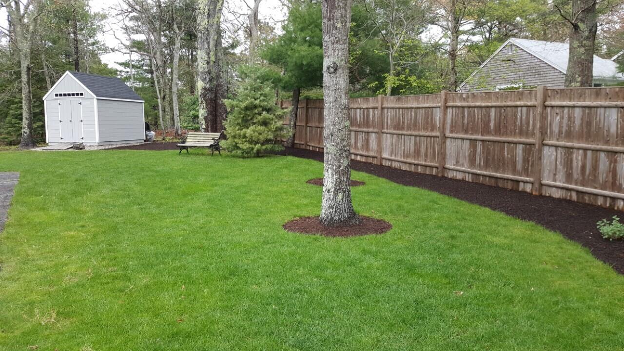 98 Valley Brook Road Centerville, MA 02632 - Photo 20 of 35 a front view of a house with garden