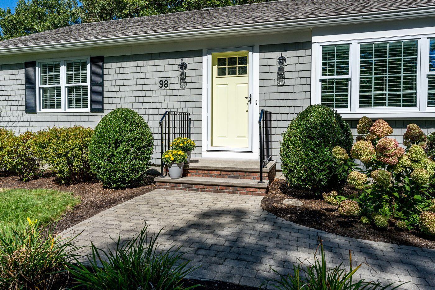 98 Valley Brook Road Centerville, MA 02632 - Photo 30 of 35 a front view of a house with a yard