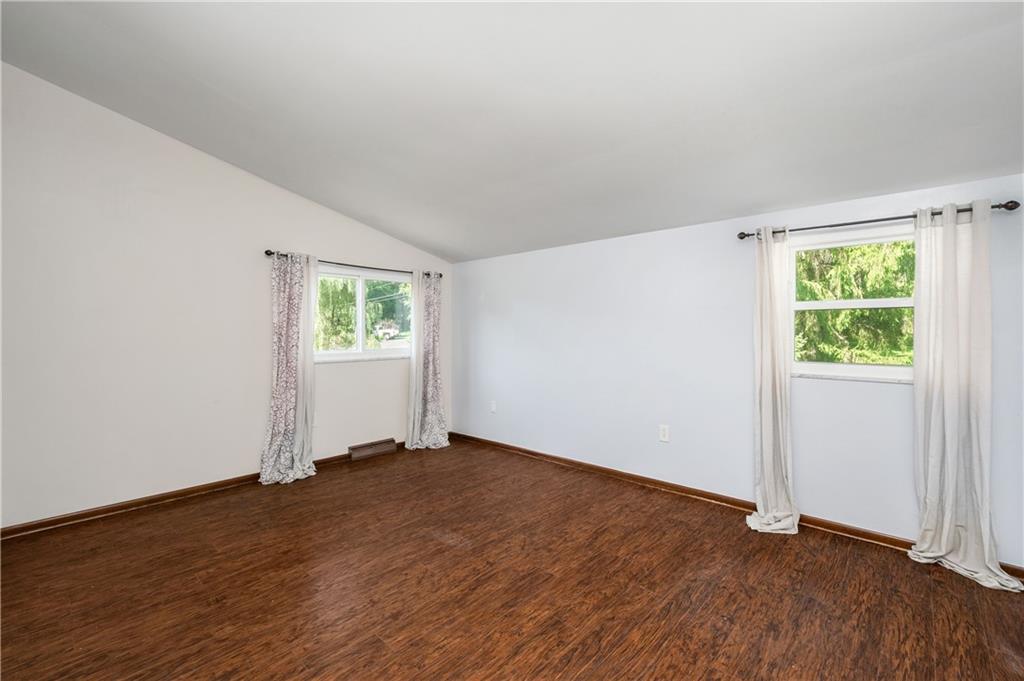 809 West Old Rte 422 Butler, PA 16001 - Photo 11 of 31 an empty room with wooden floor and windows