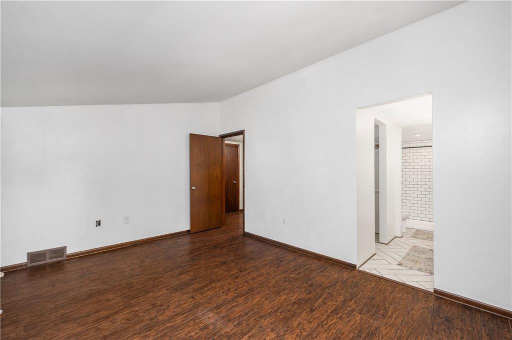 809 West Old Rte 422 Butler, PA 16001 - Photo 12 of 31 an empty room with wooden floor and windows