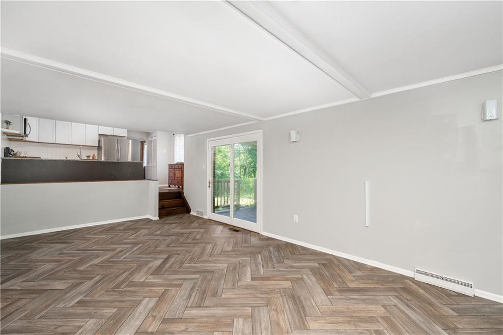 809 West Old Rte 422 Butler, PA 16001 - Photo 16 of 31 a view of a big room with wooden floor and windows