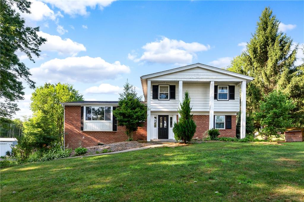809 West Old Rte 422 Butler, PA 16001 - Photo 2 of 31 a front view of house with yard and green space