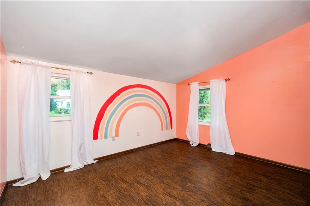 809 West Old Rte 422 Butler, PA 16001 - Photo 21 of 31 a view of empty room with wooden floor and window