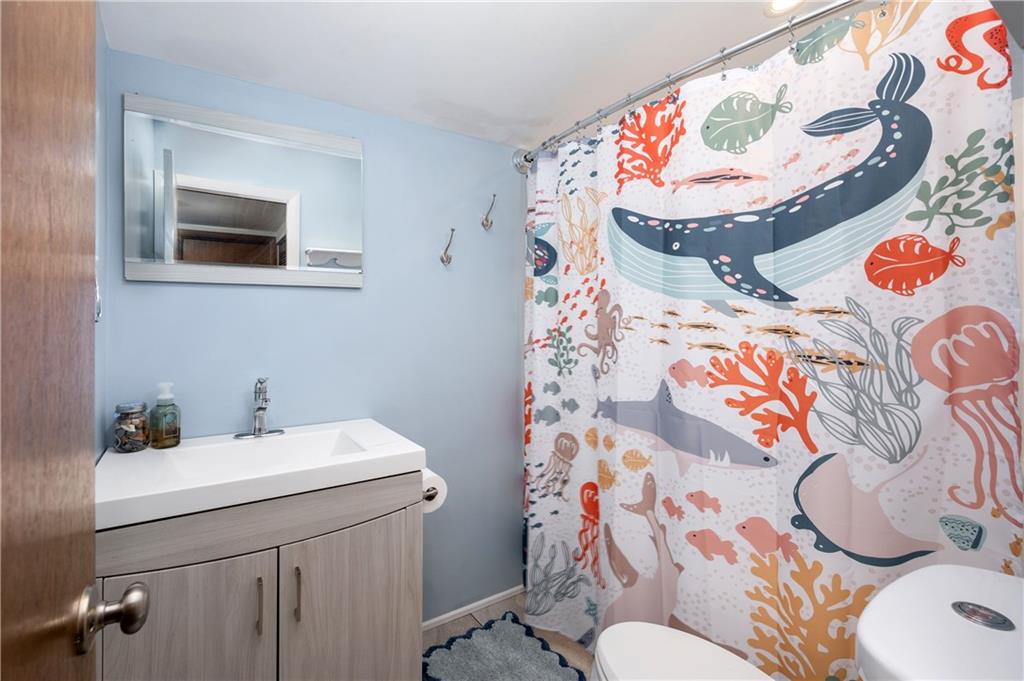 809 West Old Rte 422 Butler, PA 16001 - Photo 22 of 31 a bathroom with a sink and mirror