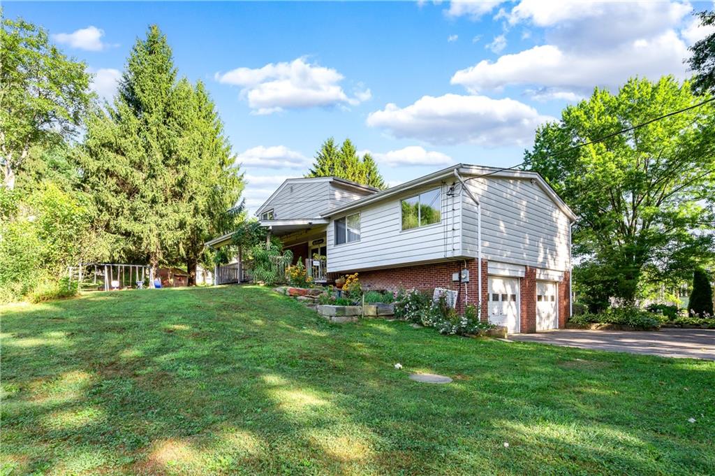 809 West Old Rte 422 Butler, PA 16001 - Photo 27 of 31 a view of a house with a big yard potted plants and large tree