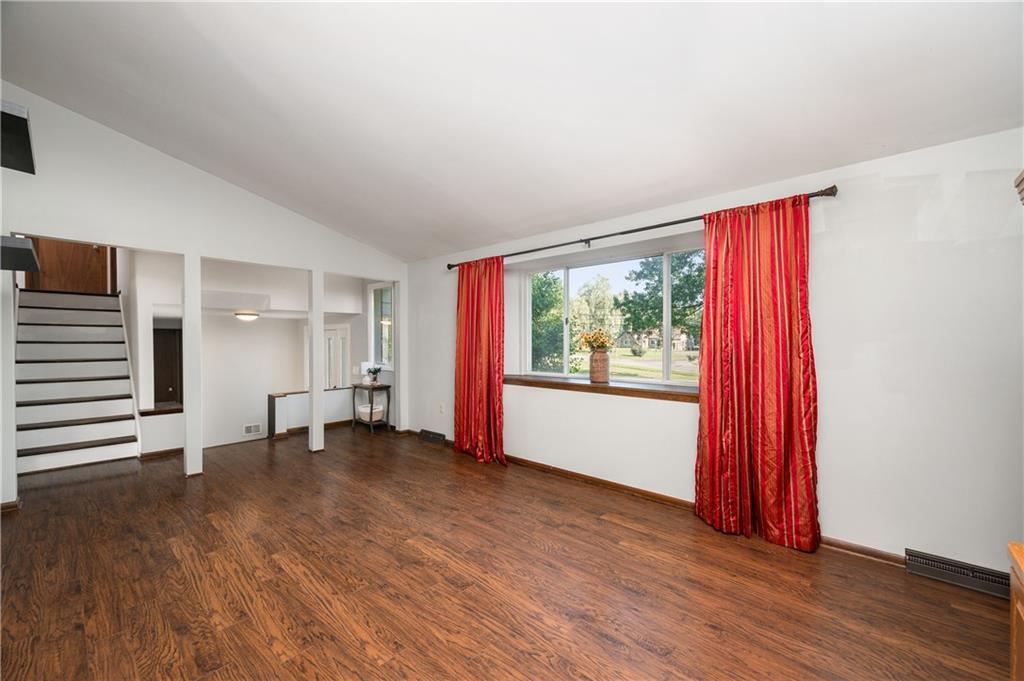 809 West Old Rte 422 Butler, PA 16001 - Photo 4 of 31 an empty room with wooden floor and windows