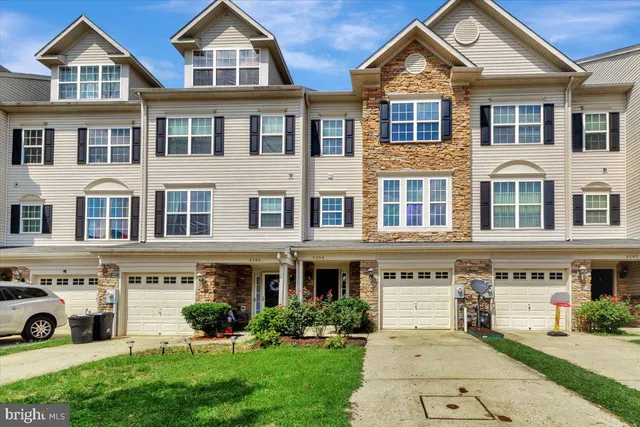 a front view of a building with garden
