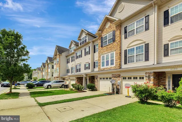 a view of a building with a yard