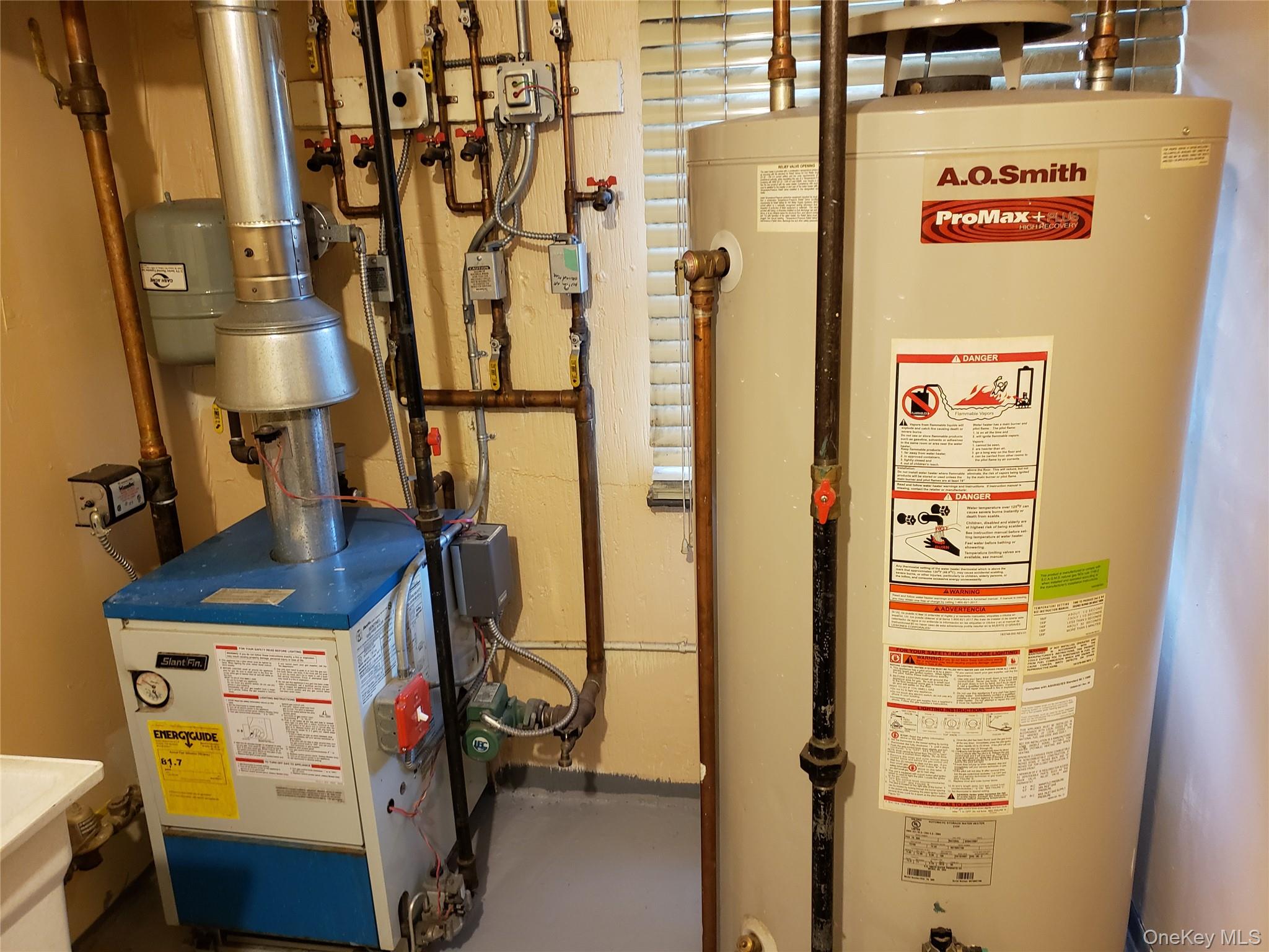 16-74 Bell Boulevard Queens, NY 11360 - Photo 18 of 20 Utility room with gas water heater and heating unit
