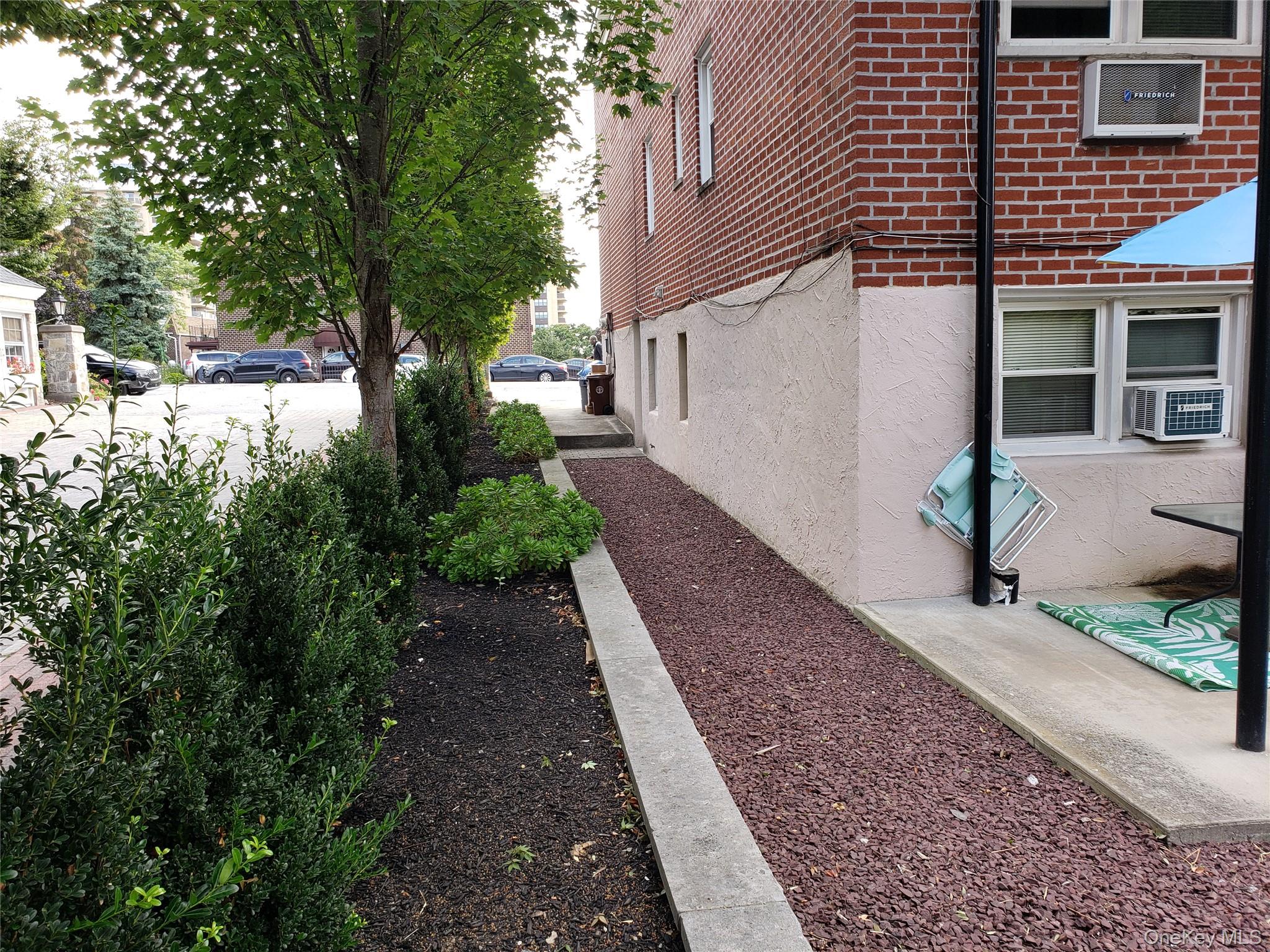 16-74 Bell Boulevard Queens, NY 11360 - Photo 3 of 20 Side VIEW of the building. Home featuring brick siding & stucco siding,