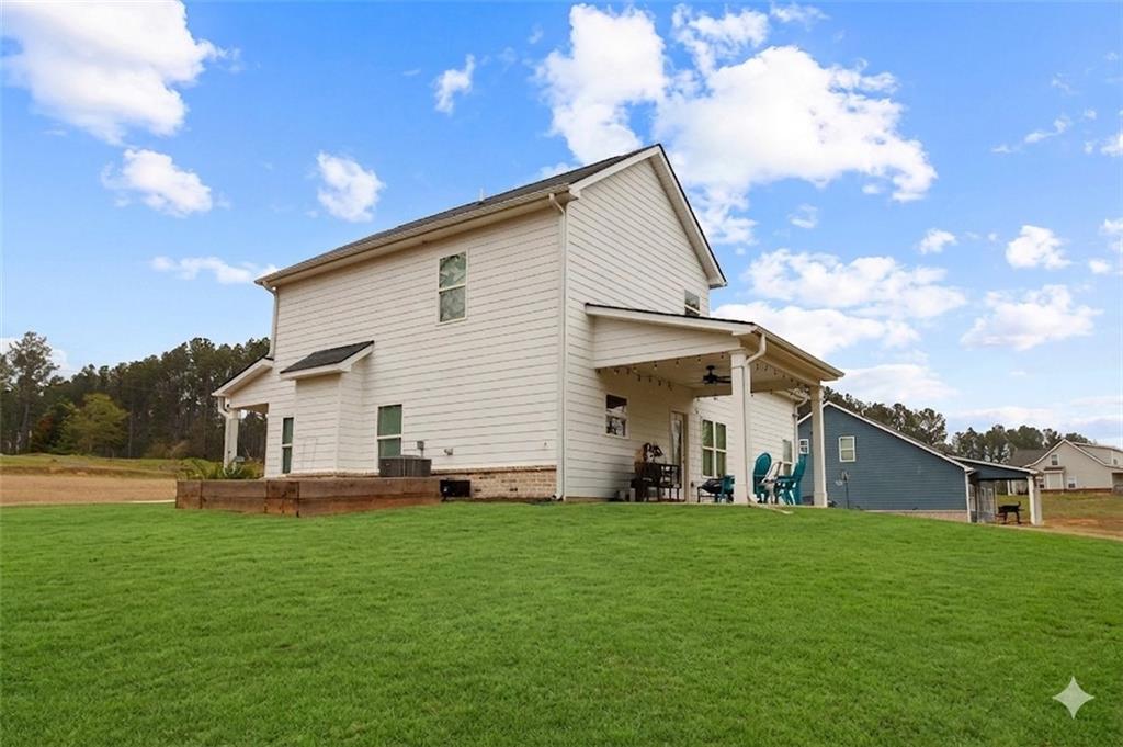171 Strickland Loop Forsyth, GA 31029 - Photo 25 of 25 a front view of house with yard and green space