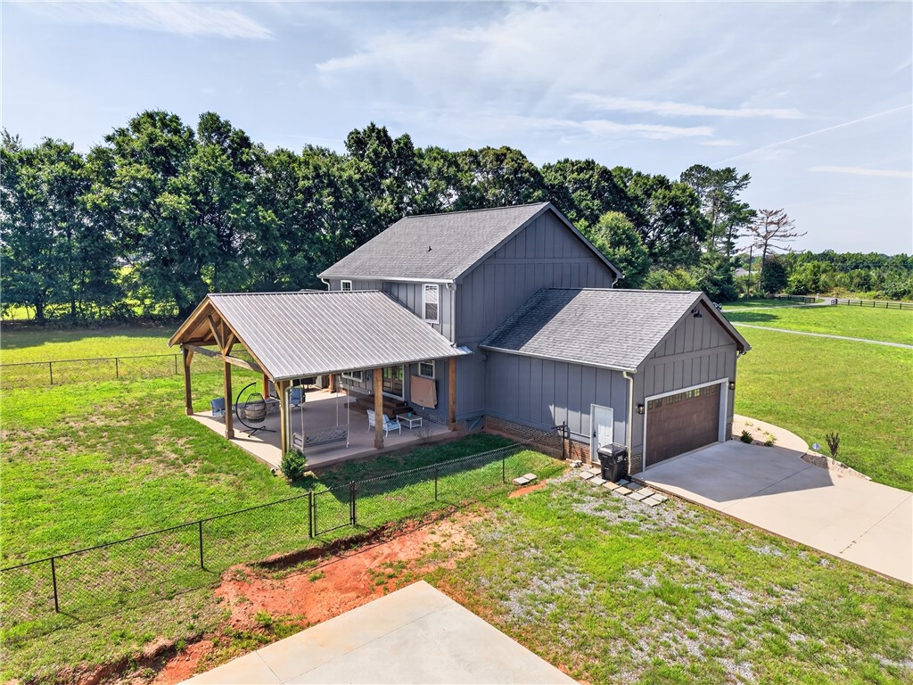 5016 Copeland Road Belton, SC 29627 - Photo 40 of 45 A spacious rear patio and fenced yard create an idyllic outdoor retreat.