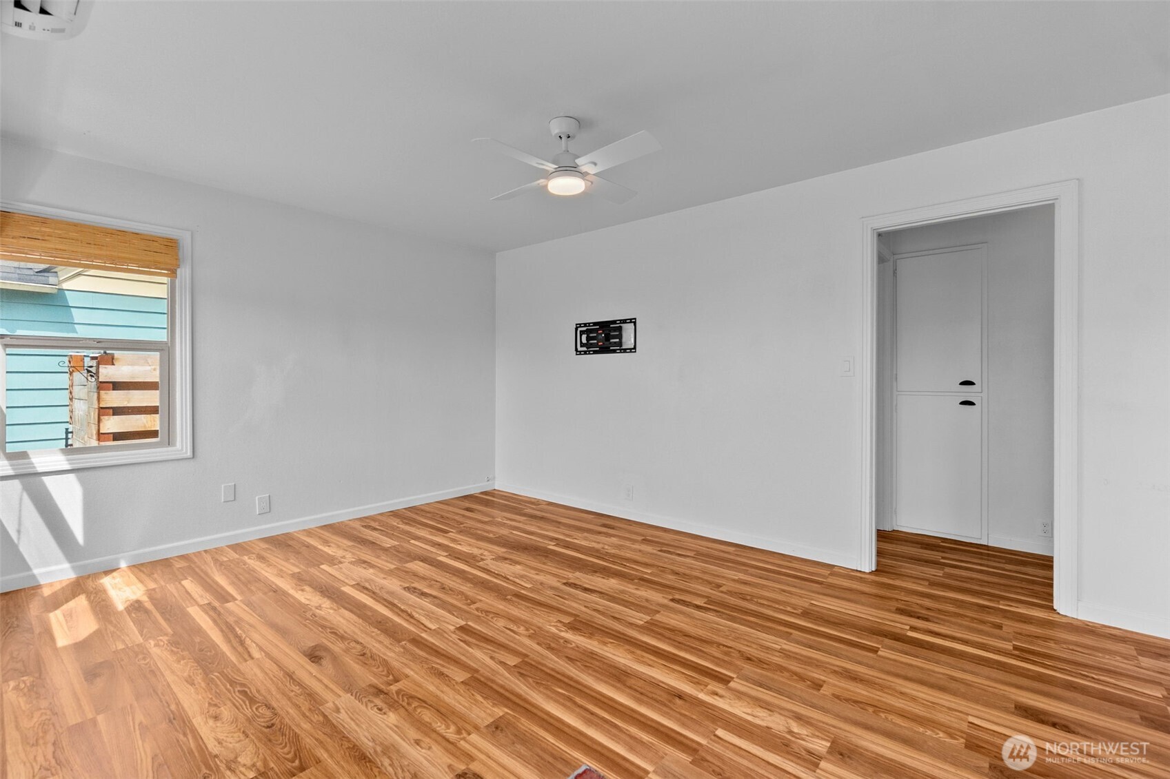 372 Southwest 14th Street Chehalis, WA 98532 - Photo 12 of 15 a view of empty room with wooden floor and fan
