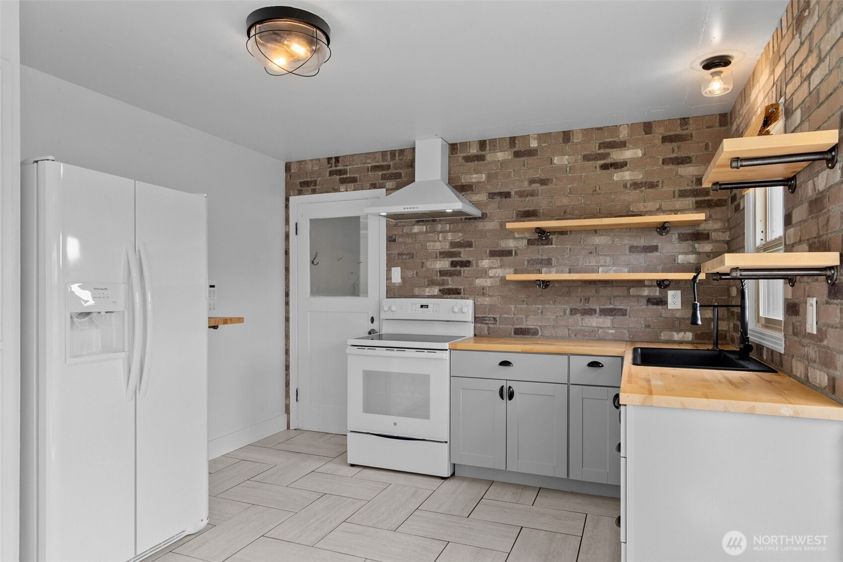 372 Southwest 14th Street Chehalis, WA 98532 - Photo 6 of 15 a kitchen with cabinets and chairs