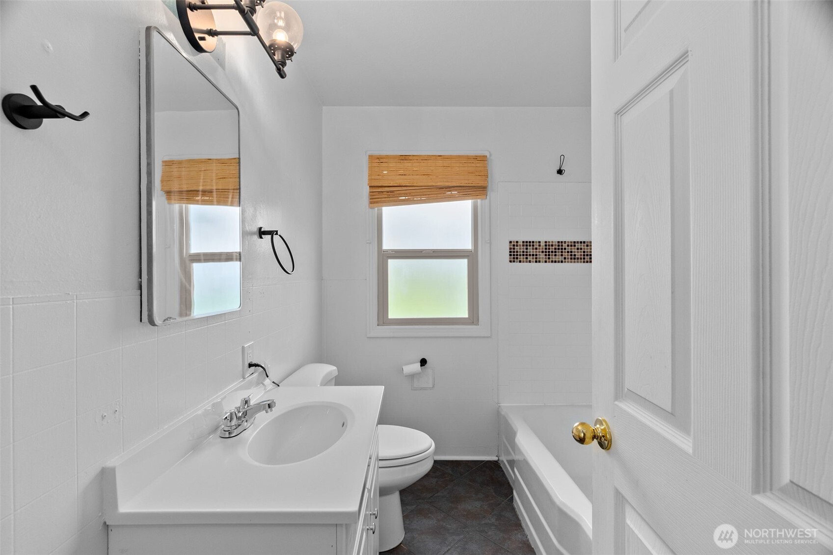 372 Southwest 14th Street Chehalis, WA 98532 - Photo 8 of 15 a bathroom with a sink a toilet and tub