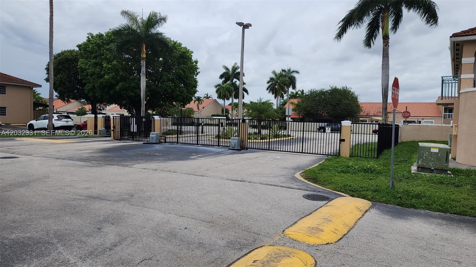 6416 Southwest 131st Path, Unit 1705 Miami, FL 33183 - Photo 20 of 29 Main entrance gate