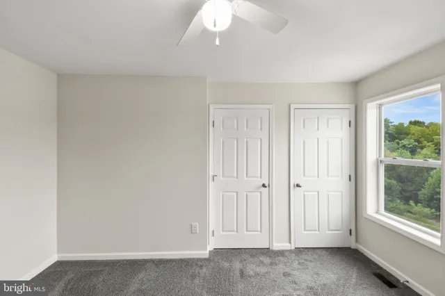 a white bath tub sitting next to a white toilet