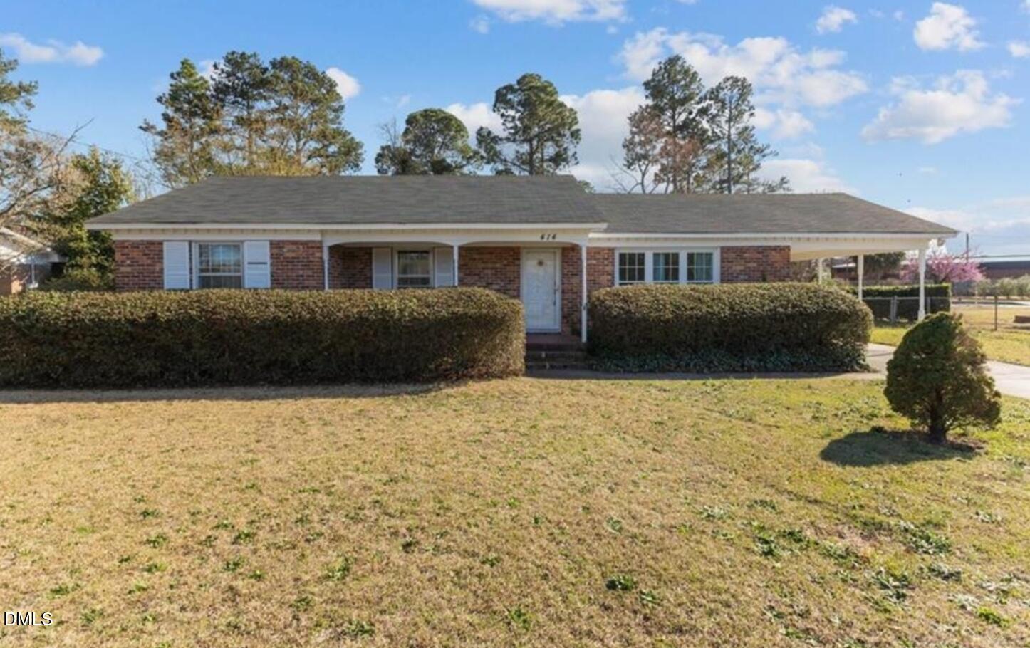 414 York Road Fayetteville, NC 28303 - Photo 1 of 14 a front view of a house with a yard