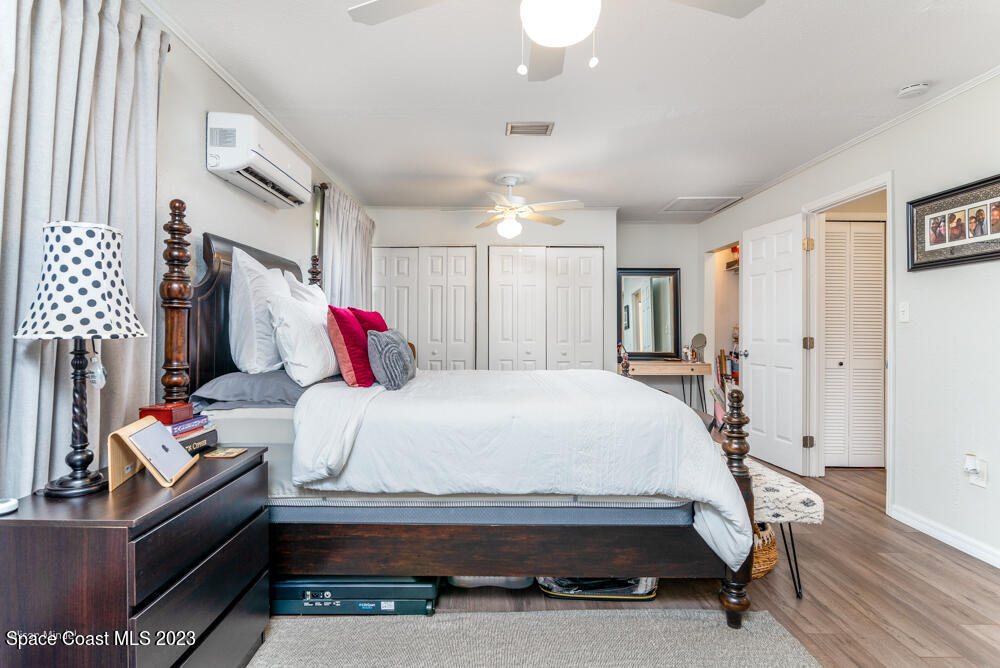 2449 Apache Drive Melbourne, FL 32935 - Photo 32 of 61 a bedroom with a bed and a window