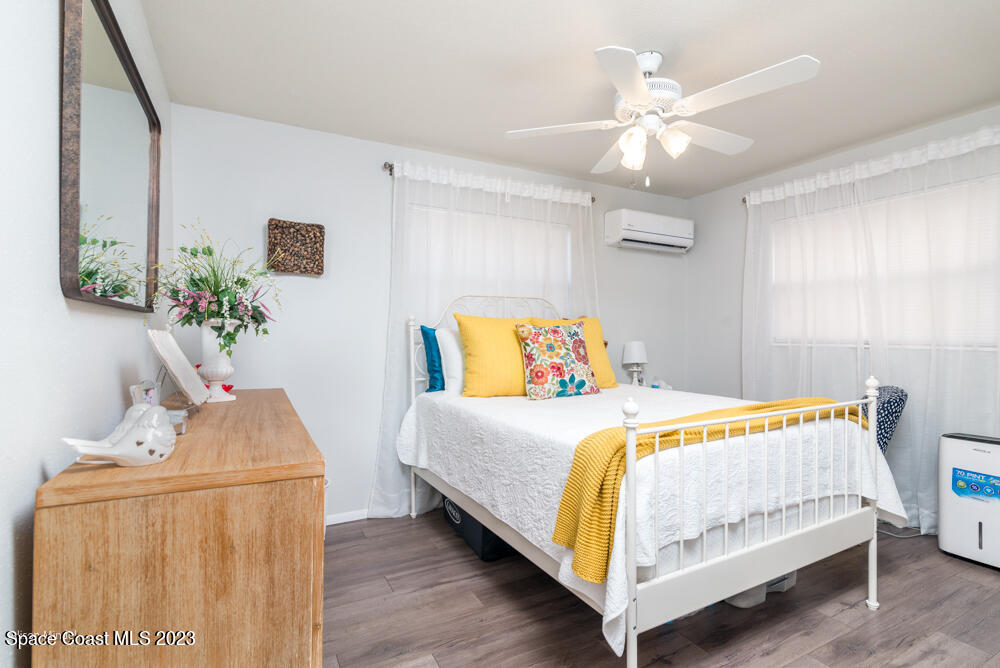 2449 Apache Drive Melbourne, FL 32935 - Photo 36 of 61 a bedroom with a bed and a dresser