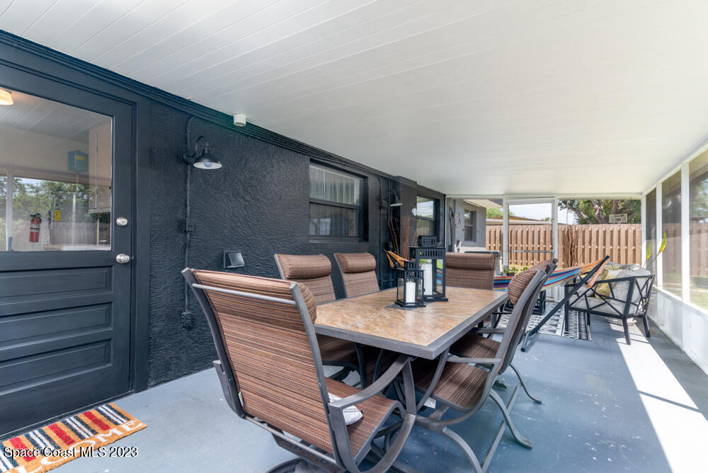 2449 Apache Drive Melbourne, FL 32935 - Photo 49 of 61 a view of a dining room with furniture and wooden floor