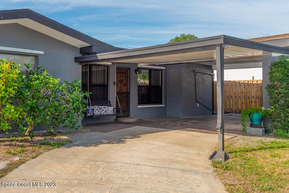2449 Apache Drive Melbourne, FL 32935 - Photo 5 of 61 a view of a house with a porch