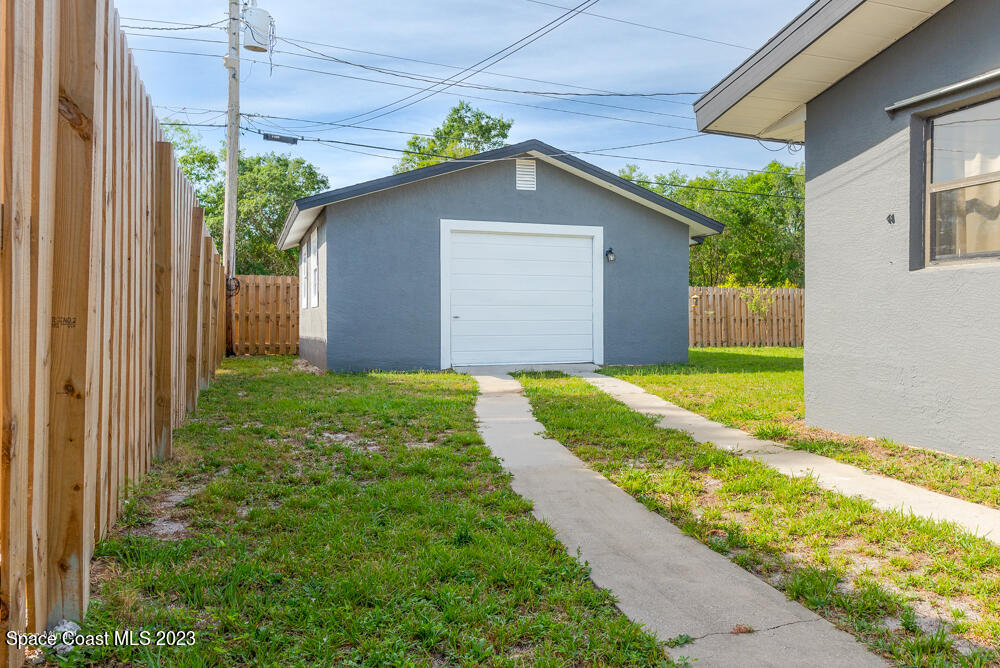 2449 Apache Drive Melbourne, FL 32935 - Photo 54 of 61 a view of a house with backyard and garden
