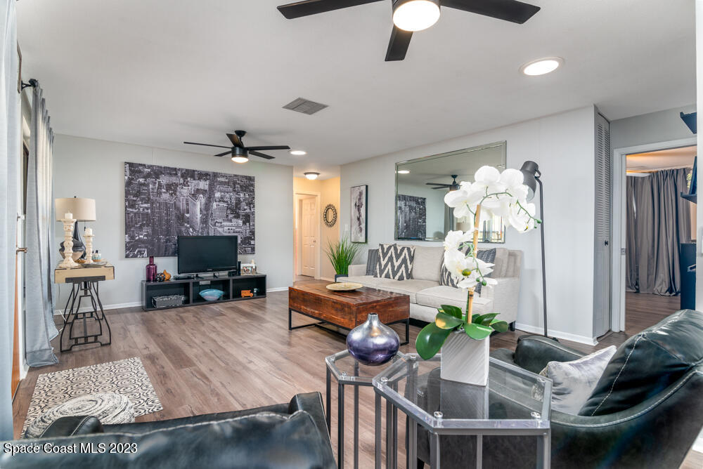 2449 Apache Drive Melbourne, FL 32935 - Photo 8 of 61 a living room with furniture and a fireplace
