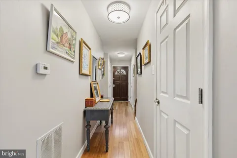 a bathroom with a sink vanity and a mirror