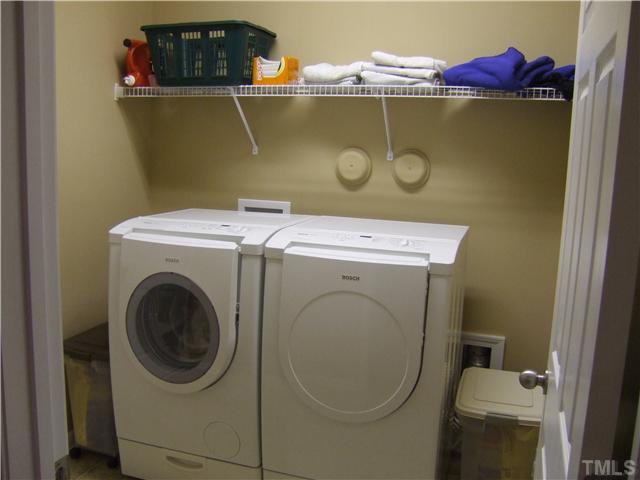 3218 Dove Tree Lane Raleigh, NC 27610 - Photo 13 of 15 a utility room with dryer and washer