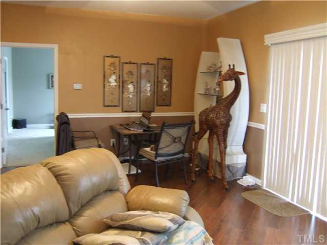 3218 Dove Tree Lane Raleigh, NC 27610 - Photo 3 of 15 a living room with furniture and a wooden floor