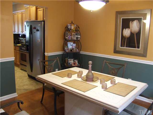 3218 Dove Tree Lane Raleigh, NC 27610 - Photo 6 of 15 a dining table with chairs and wooden floor