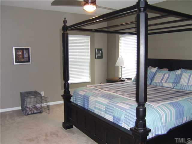 3218 Dove Tree Lane Raleigh, NC 27610 - Photo 7 of 15 a bedroom with a bed and a window