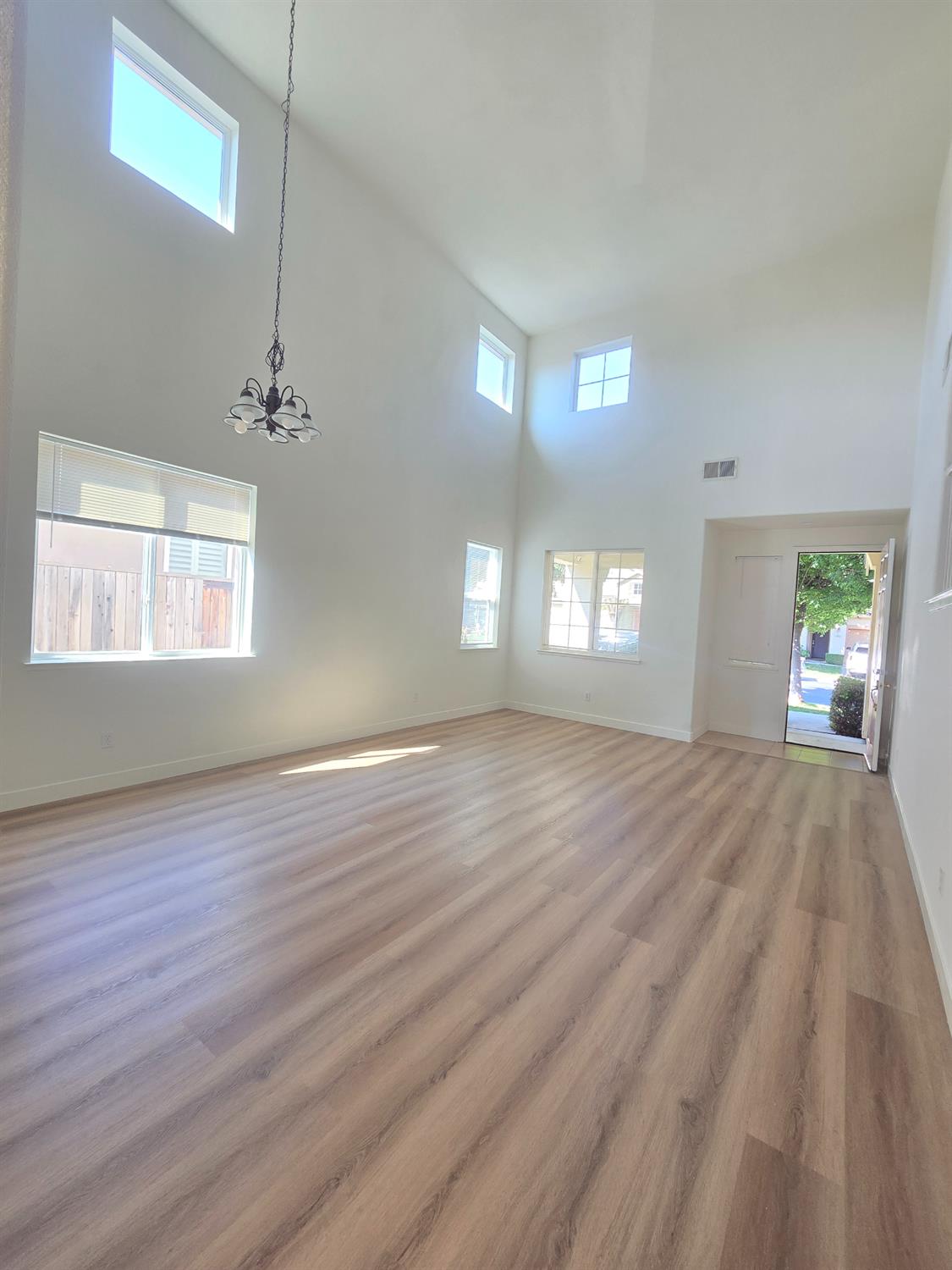 10554 Rudder Way Stockton, CA 95209 - Photo 20 of 40 a view of empty room with window and wooden floor