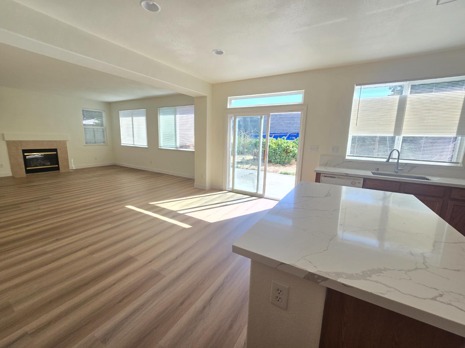 10554 Rudder Way Stockton, CA 95209 - Photo 31 of 40 an empty room with wooden floor and windows