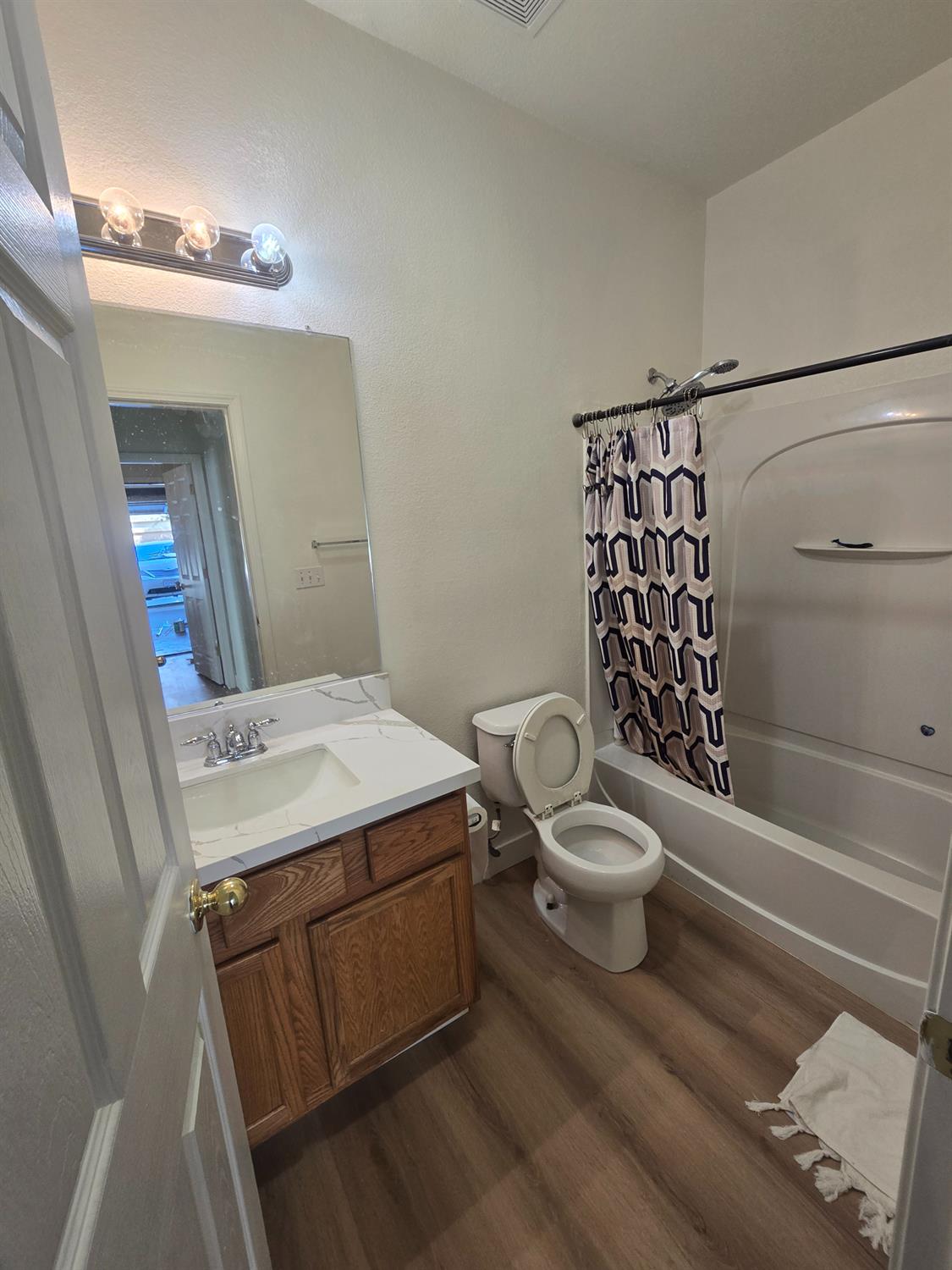 10554 Rudder Way Stockton, CA 95209 - Photo 36 of 40 a bathroom with a sink a toilet and shower