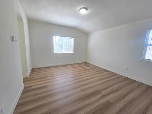 a spacious bathroom with a double vanity sink and a mirror