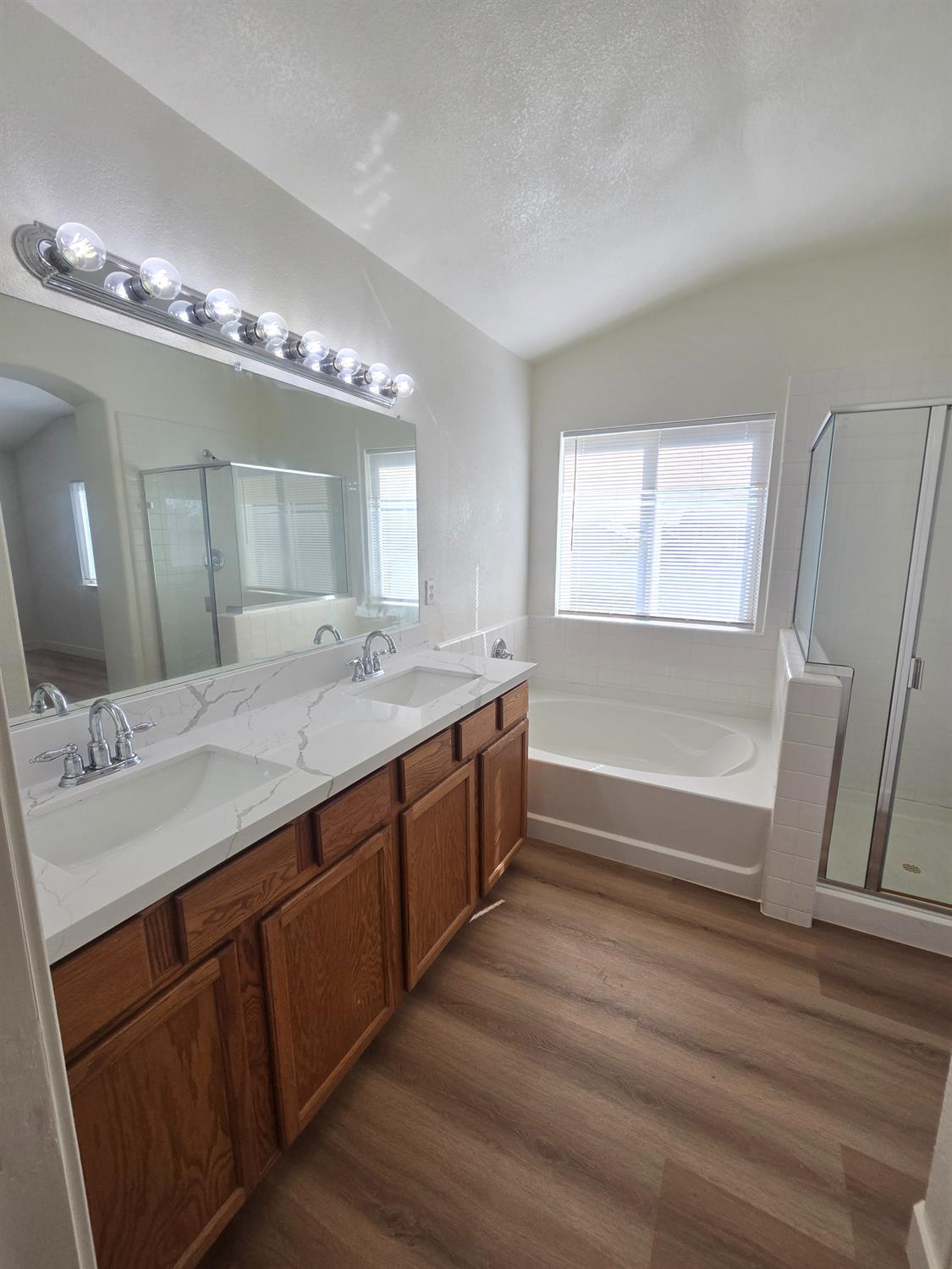 10554 Rudder Way Stockton, CA 95209 - Photo 10 of 40 a spacious bathroom with a double vanity sink and a mirror