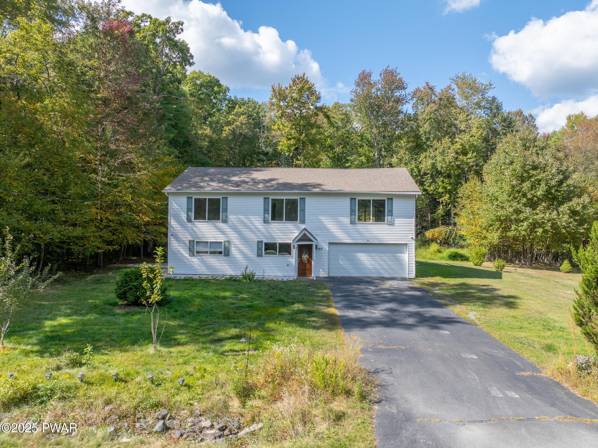 153 Hatton Road Hawley, PA 18428 - Photo 34 of 38 a view of a house with backyard and a tree