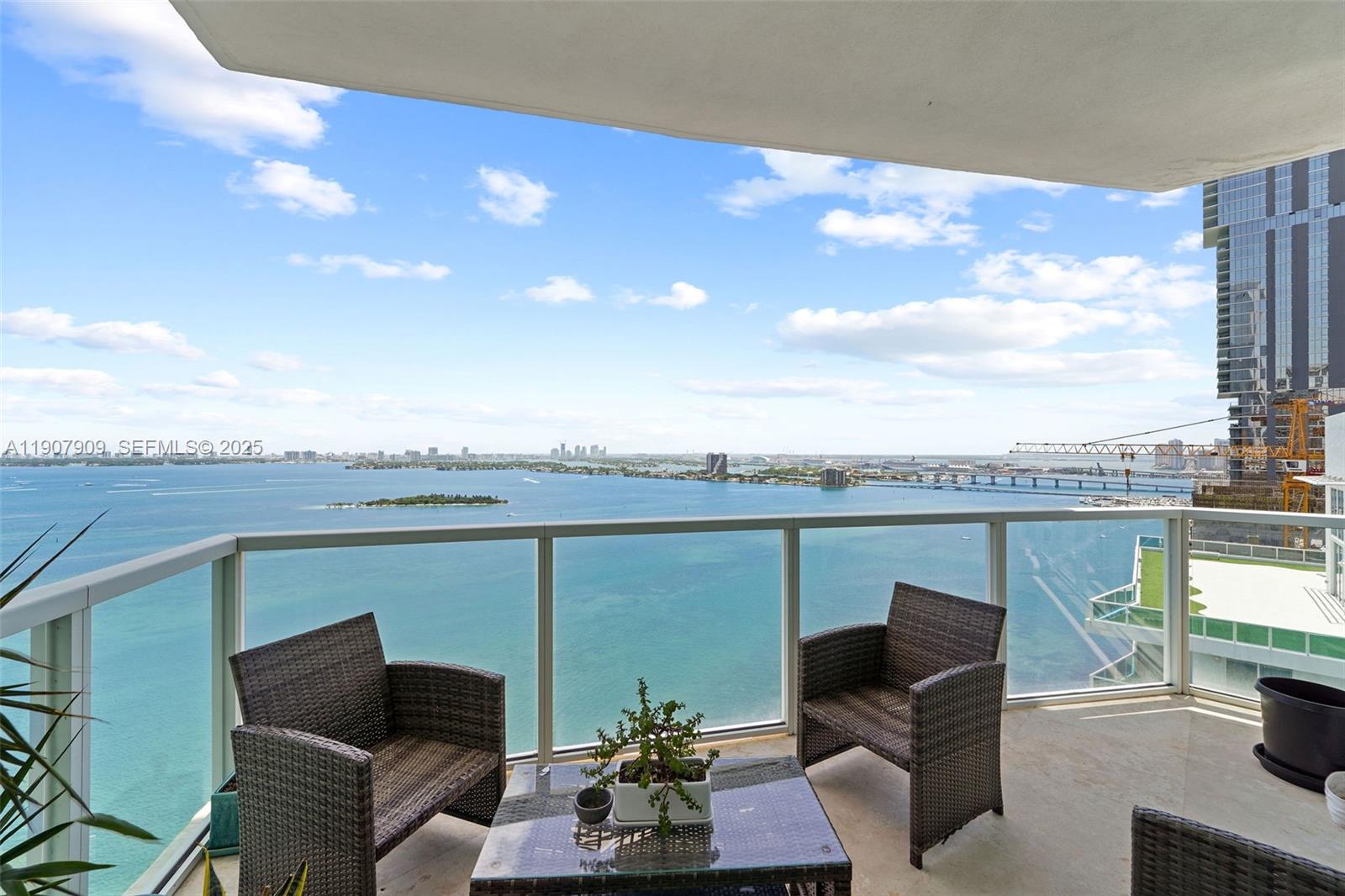 665 Northeast 25th Street, Unit PHI01 Miami, FL 33137 - Photo 1 of 38 a view of a terrace with couches and a table