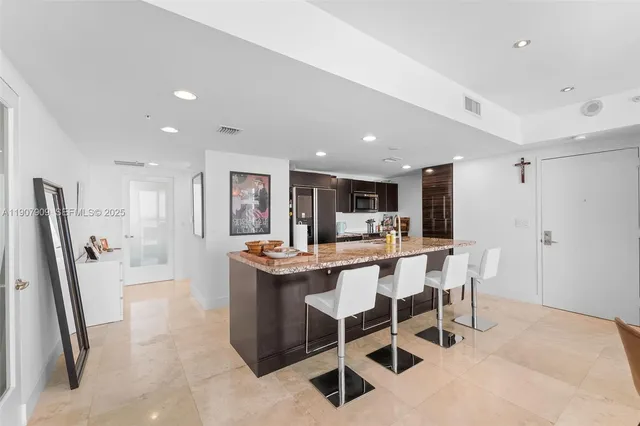 a view of a very nice looking dining room with furniture