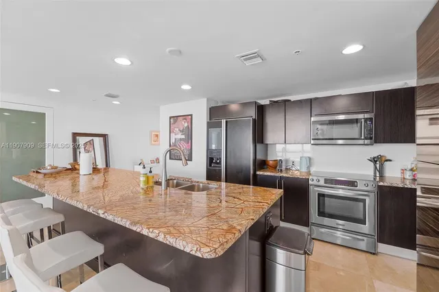 a kitchen with lots of counter top space and living room